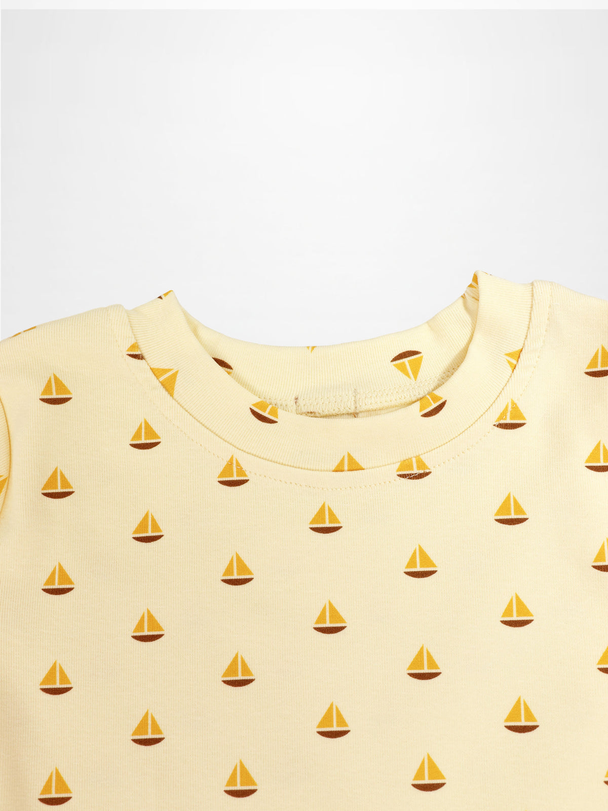 Boat Print Set for little boys, Adee brand; pale yellow knit fabric with small orange sailboats.