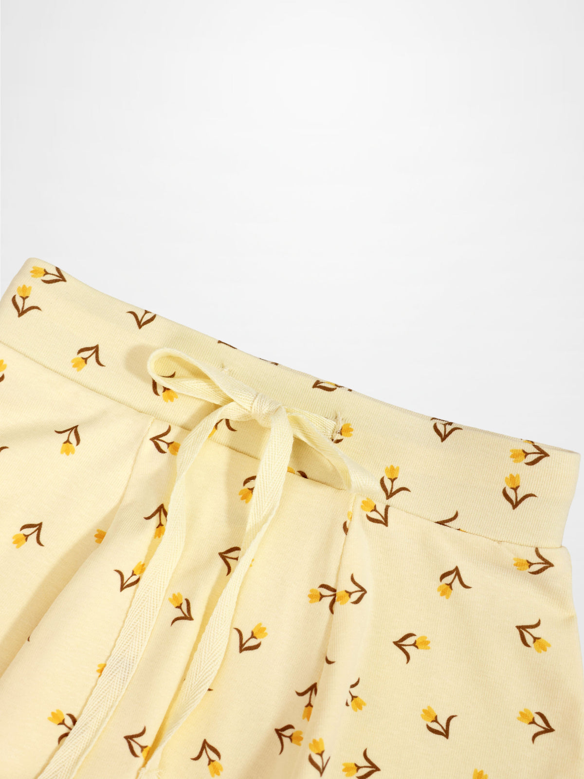 Butter Yellow Tulip 6 Panel Skirt; pale yellow fabric with tiny floral print and drawstring waist.