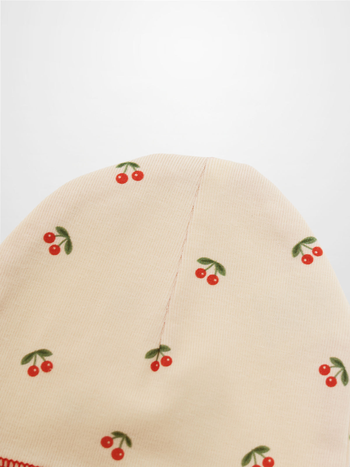 Red Cherry Hat by Adee; cream hat for girls with scattered red cherries print.