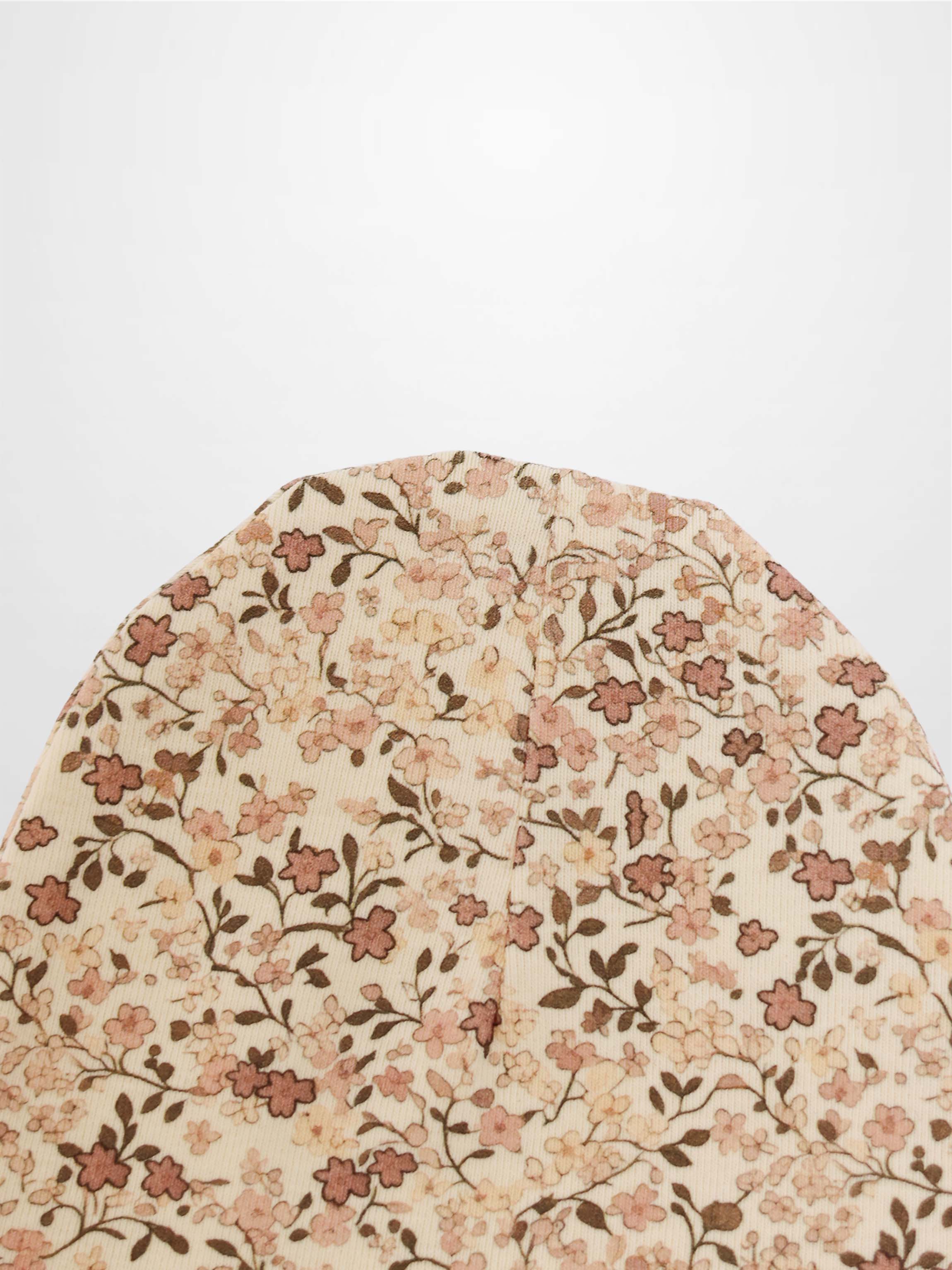 Purple Flower Hat for girls by Adee with an all-over floral print on beige fabric.