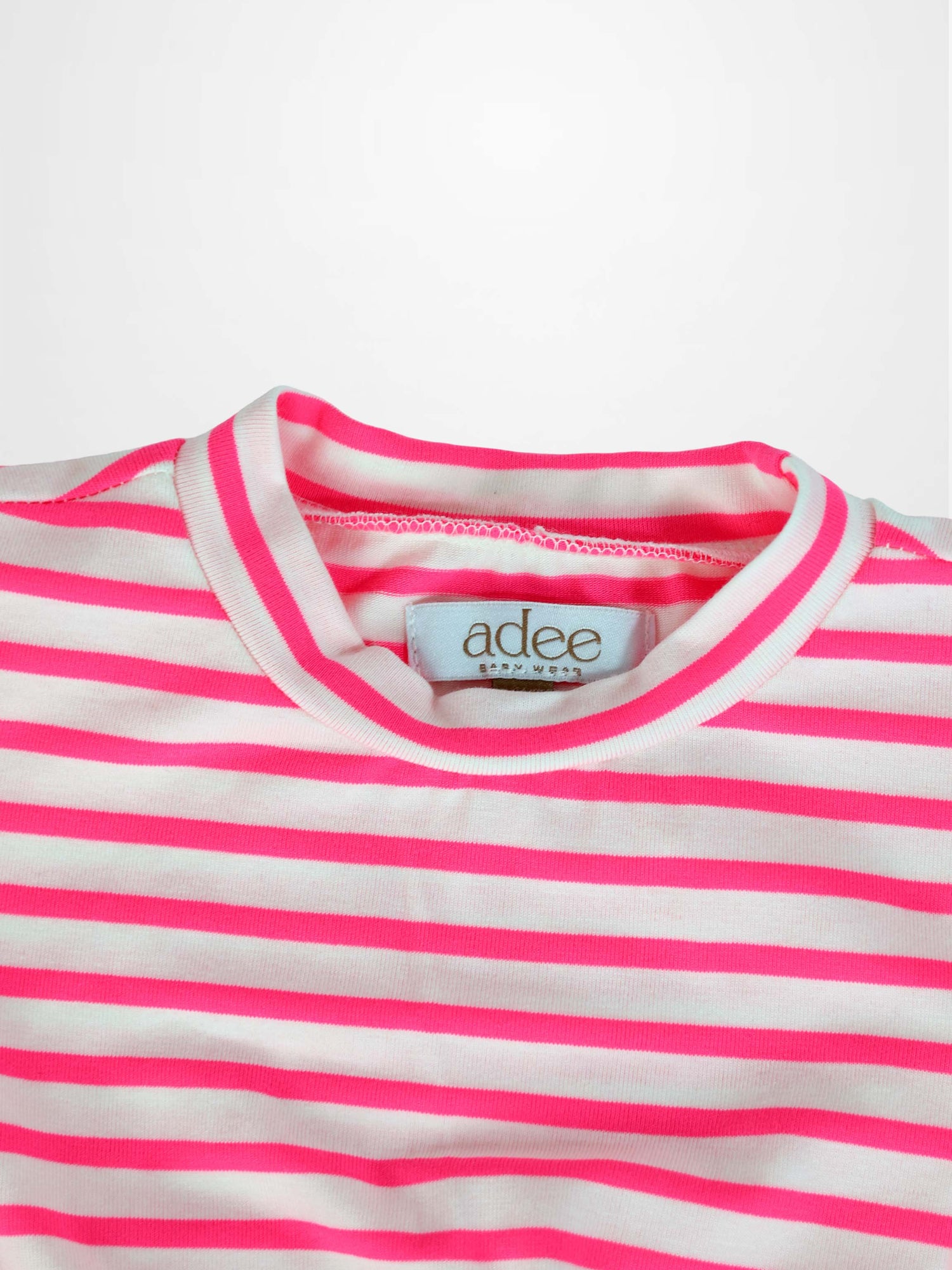 Neon pink striped dress for girls, short sleeves, Adee brand, label visible.