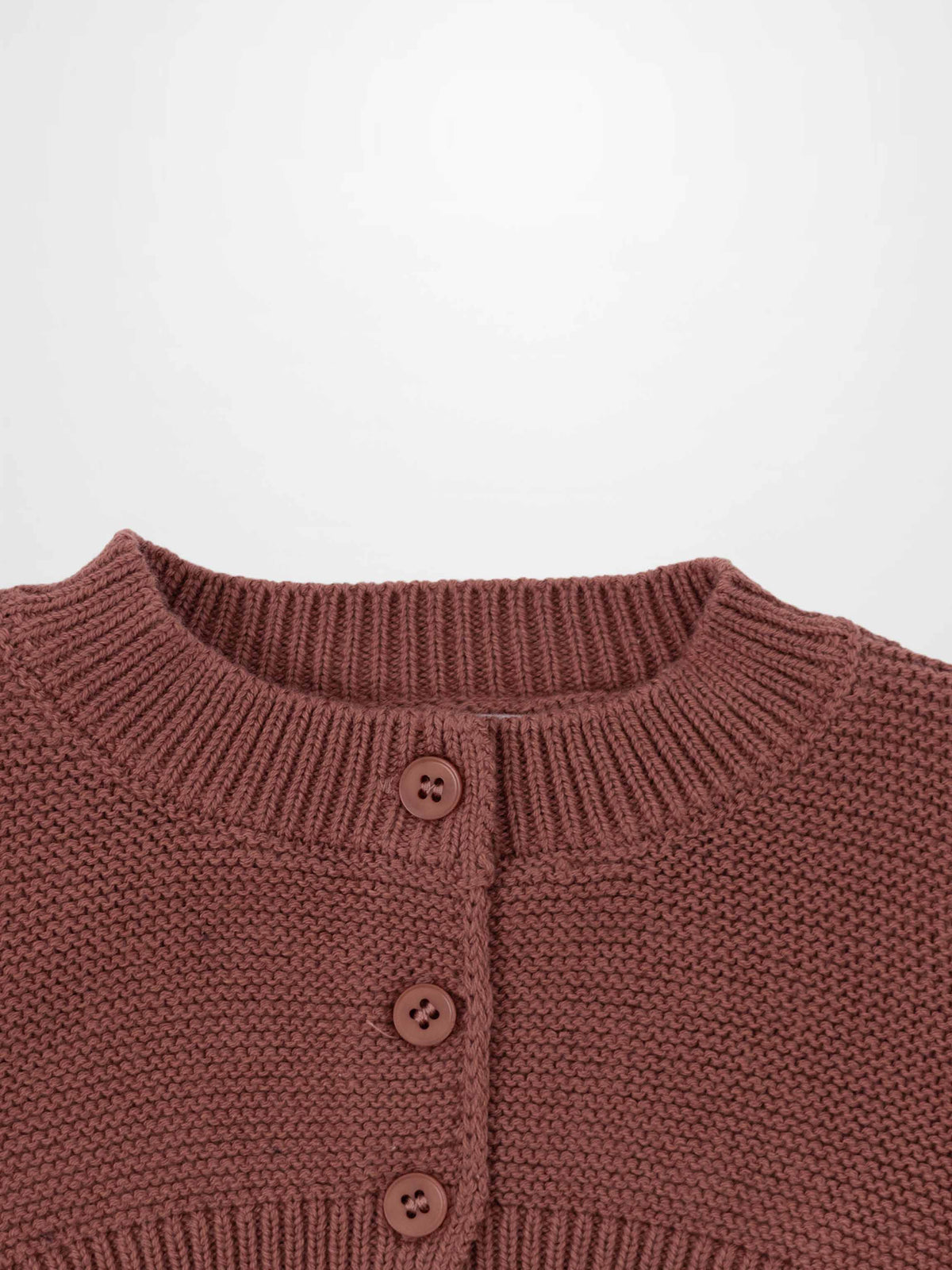 Cropped cardigan in pink for girls, knit sweater with ribbed collar and front button closure.
