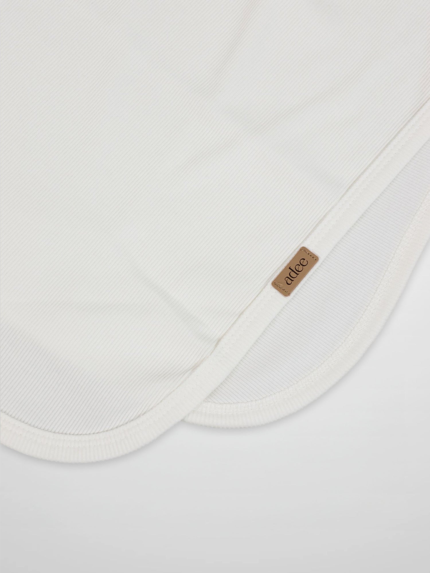 Thin Ribbed Blanket - White, unisex Adee blanket with ribbed knit and leather tag.