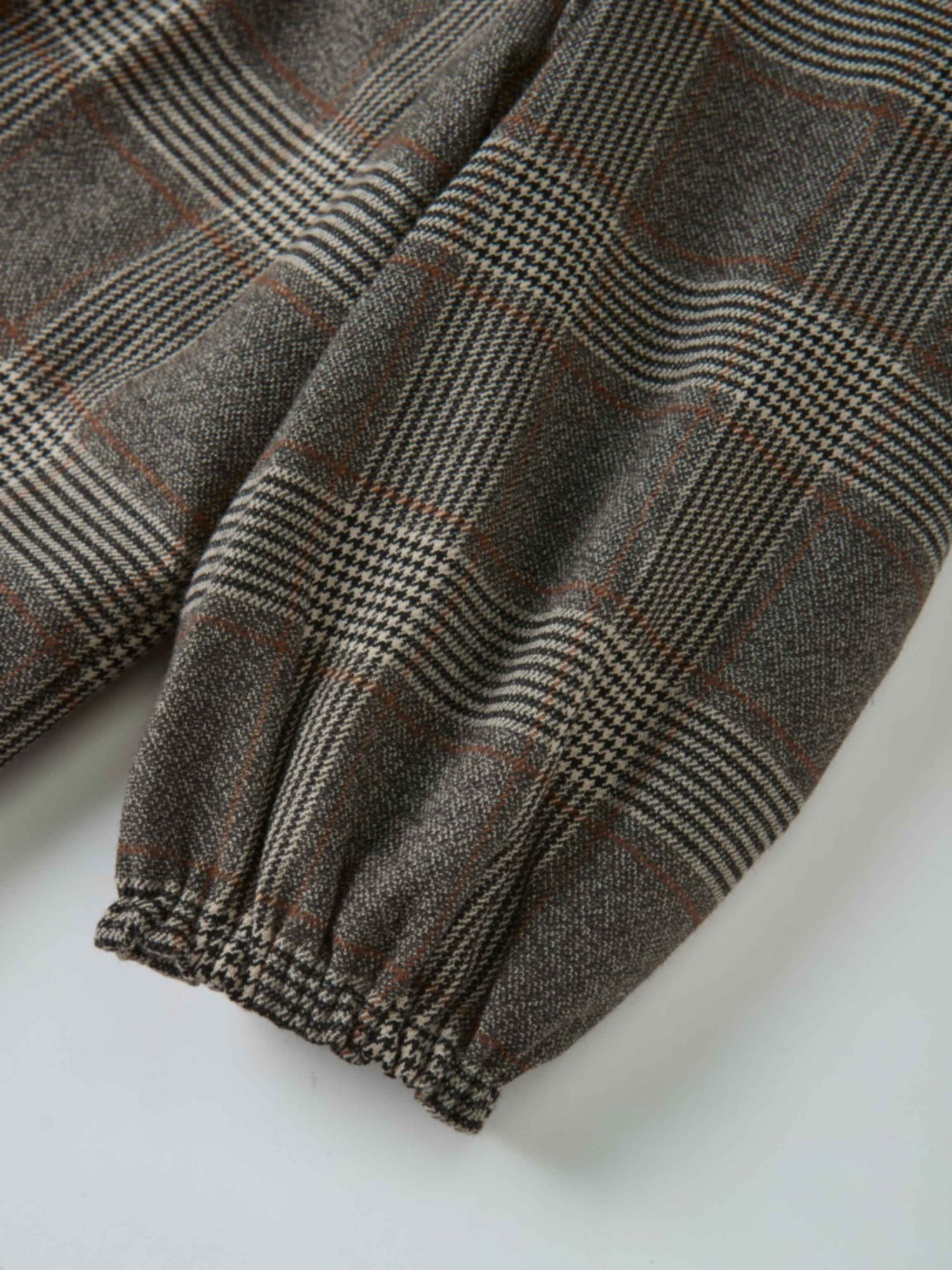 Plaid shirt and bloomers set grey fabric close-up with pattern detail