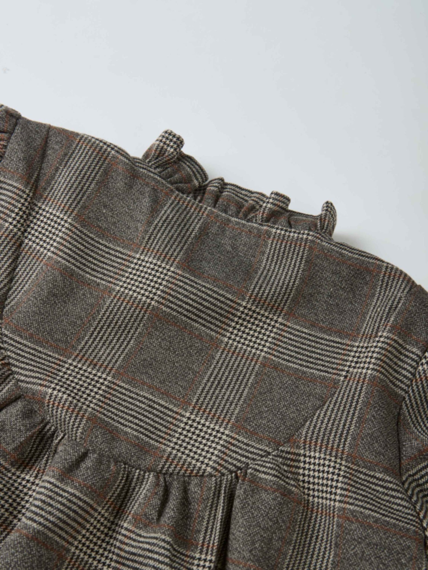 Plaid shirt and bloomers set, grey fabric with small checks and rust lines, featuring a ruffled edge.