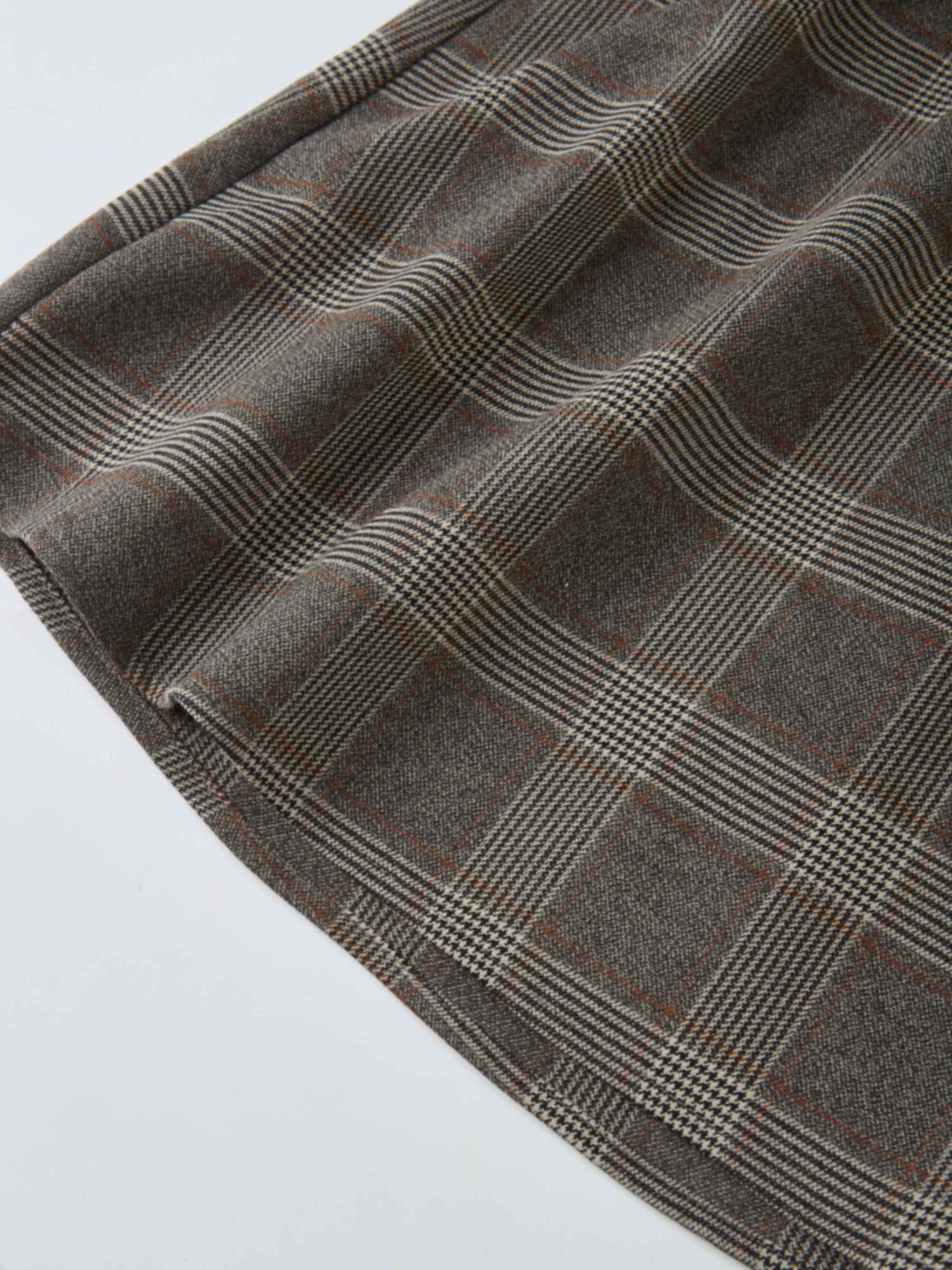 Plaid Dress - Grey fabric close-up showing brown and grey woven plaid with soft folds