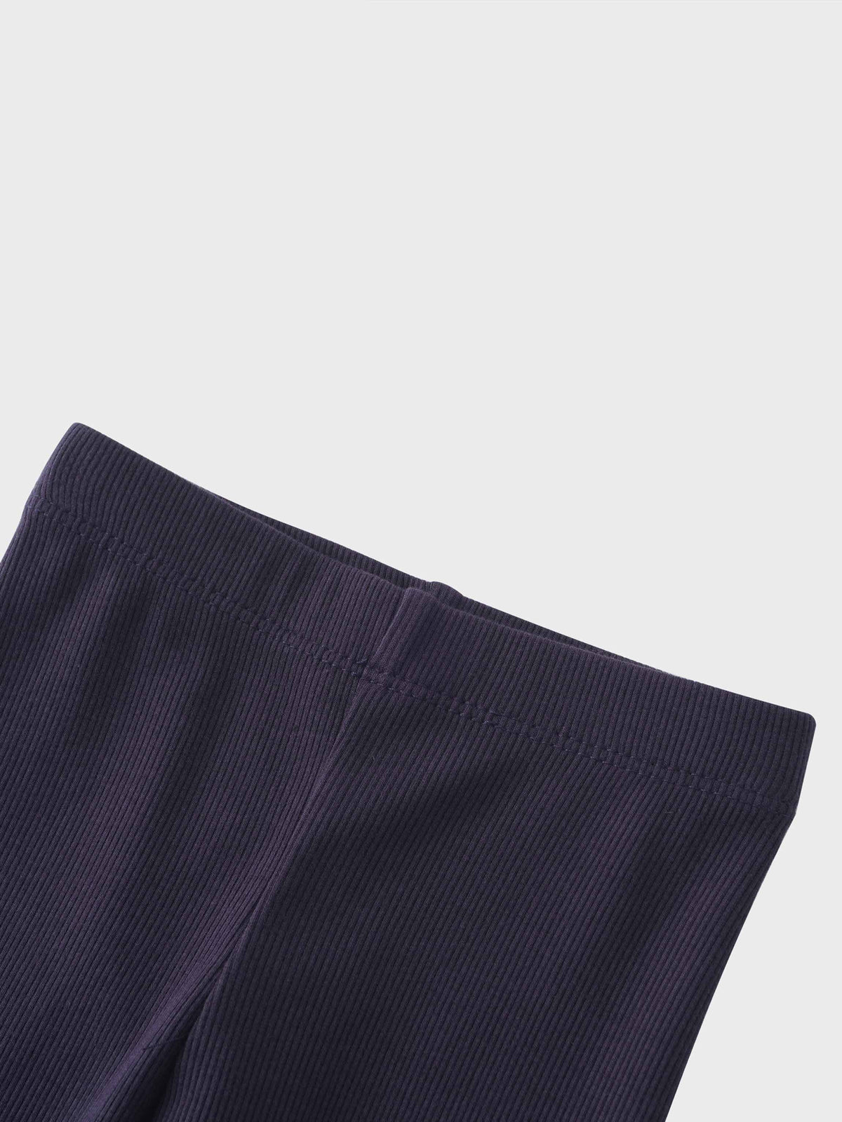Navy crossover thin ribbed pajama pants waistband close-up.