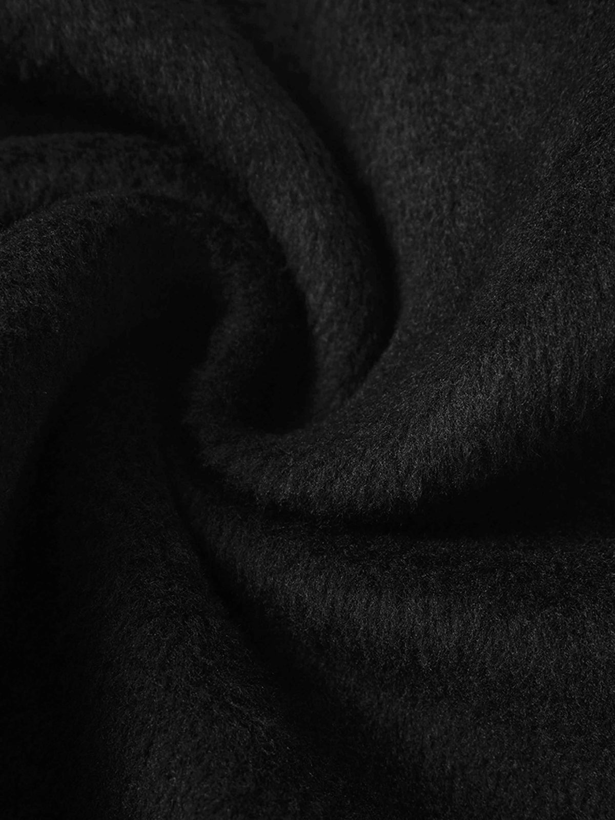 Close-up of black fleece fabric from the Skyline Sweatshirt.