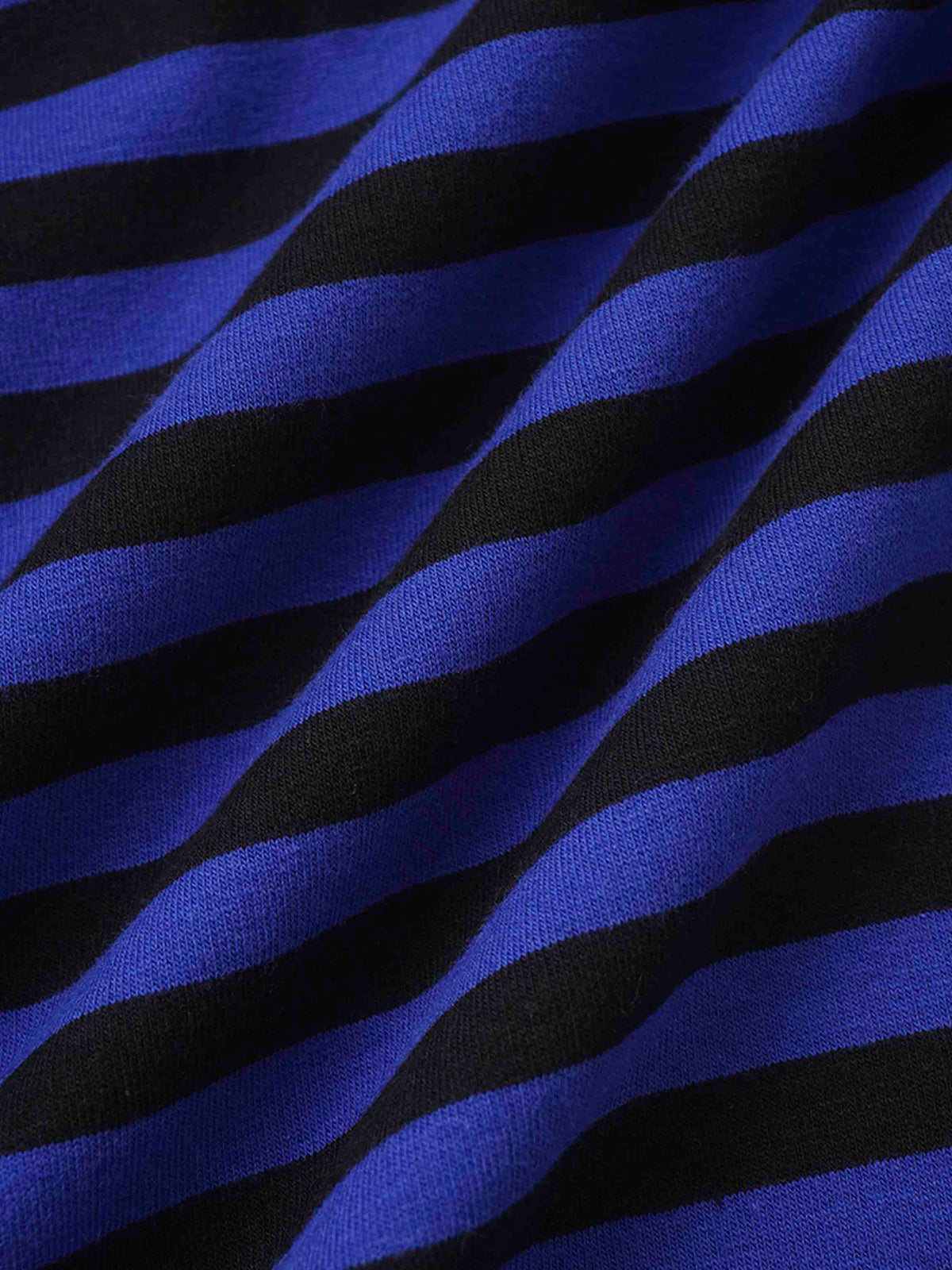 Close-up of blue and black striped knit fabric from a cozy sweatshirt.