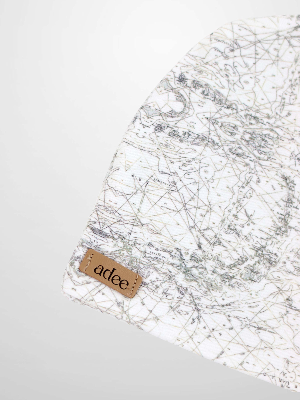 Map Beanie for boys by Adee; off-white knit with map-print pattern and leather tag