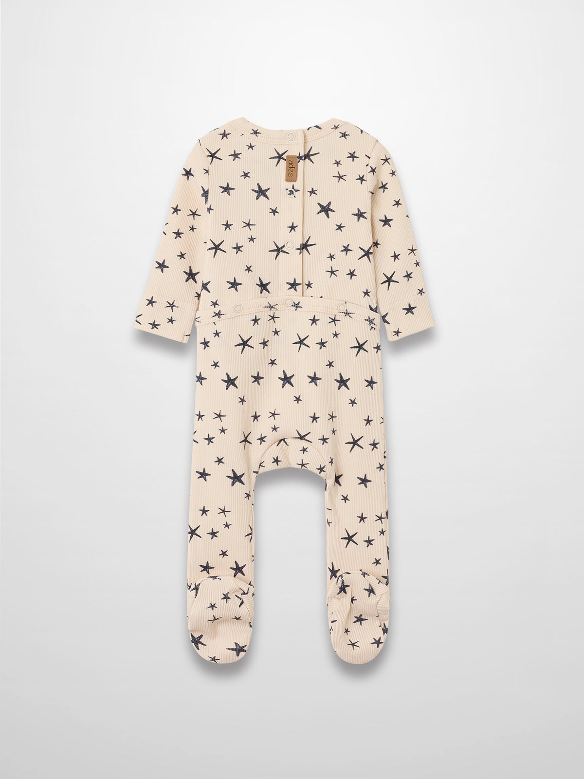 Star Stretchy footed romper for boys in light beige with navy star print by Adee