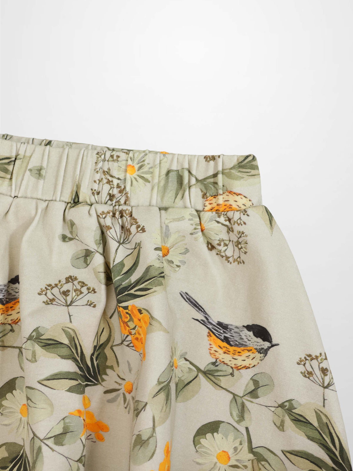 Garden Finch Circle Skirt for girls, Adee floral beige print with orange accents and elastic waist.