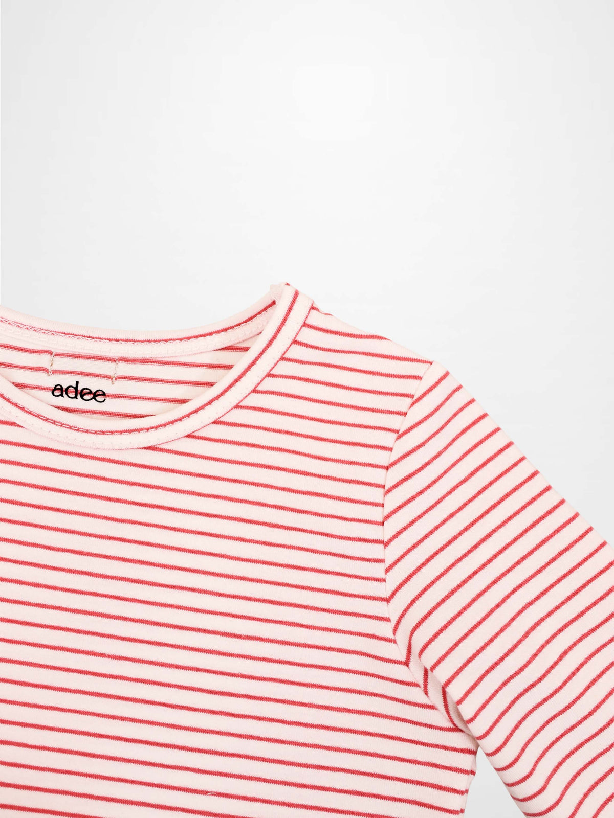 Adee pink striped 3/4 sleeve girls T-shirt with thin red stripes and a crew neck.