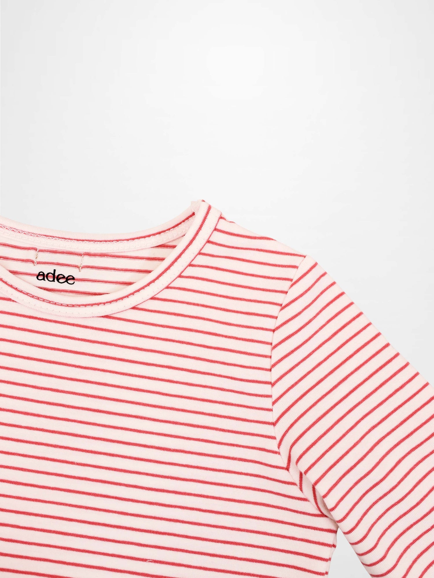 Adee pink striped 3/4 sleeve girls T-shirt with thin red stripes and a crew neck.