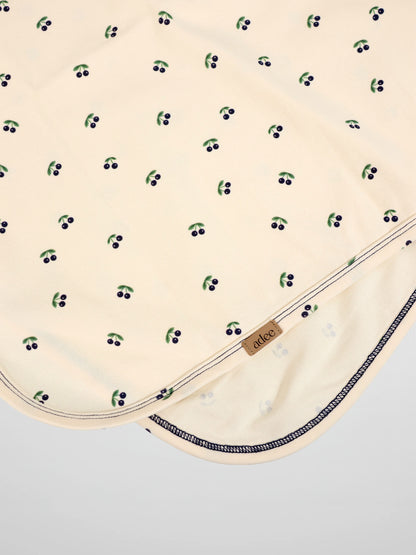 Blue Cherry Blanket by Adee; cream boys swaddle blanket with scattered blue cherries