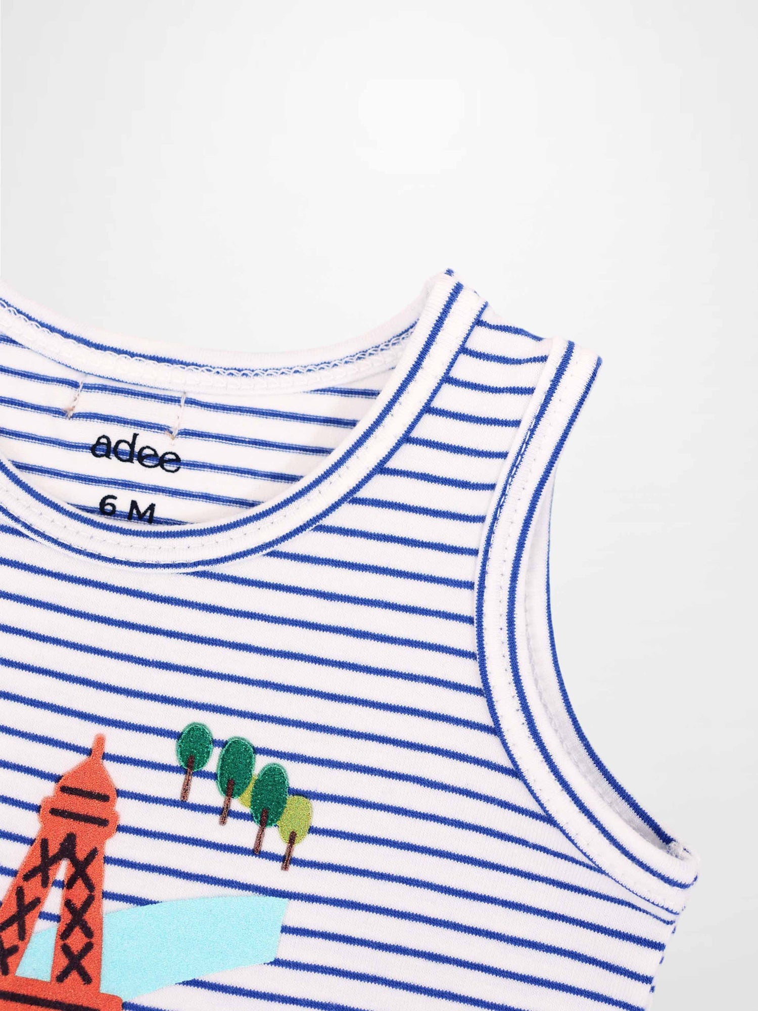 Adee Eiffel Tower Bloomers &amp; Tank Set tank top, white with blue stripes and orange tower with green trees graphic.