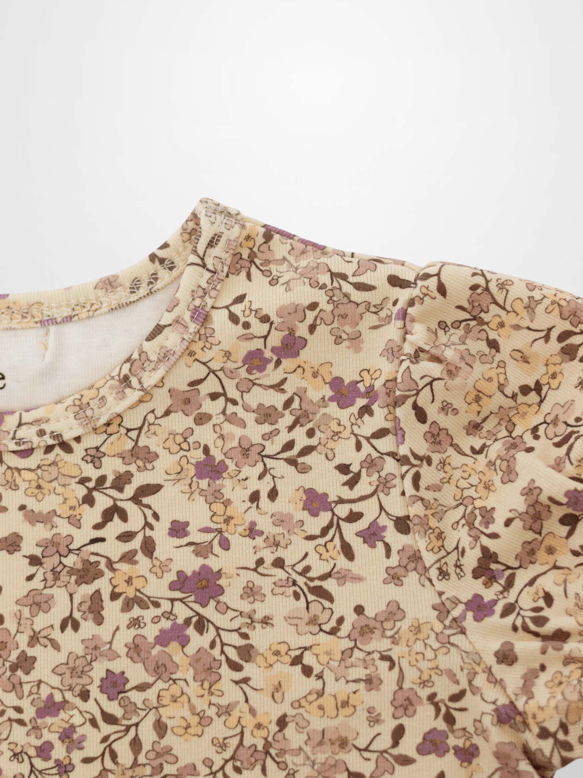 Girls floral T-shirt in beige fabric with purple and brown blossoms, patterned top for everyday wear