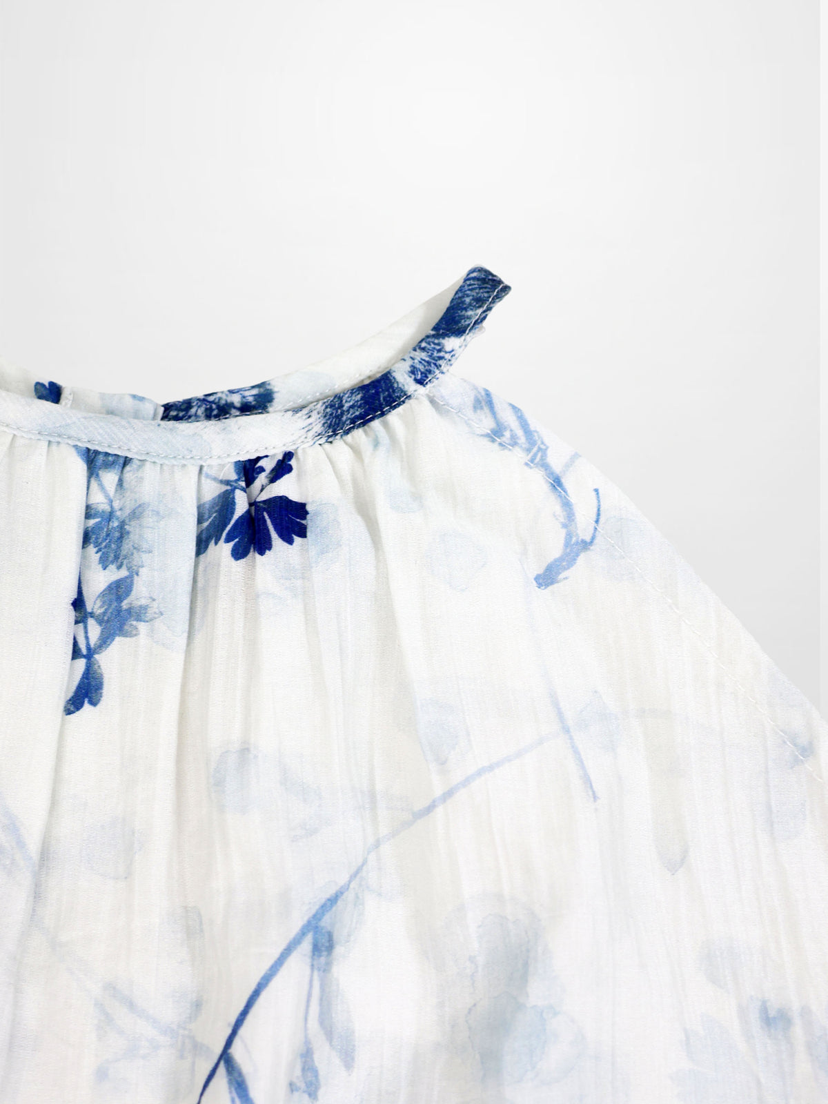 Blue Flower Jumper by Adee for girls; dressy white fabric with blue floral print neckline detail