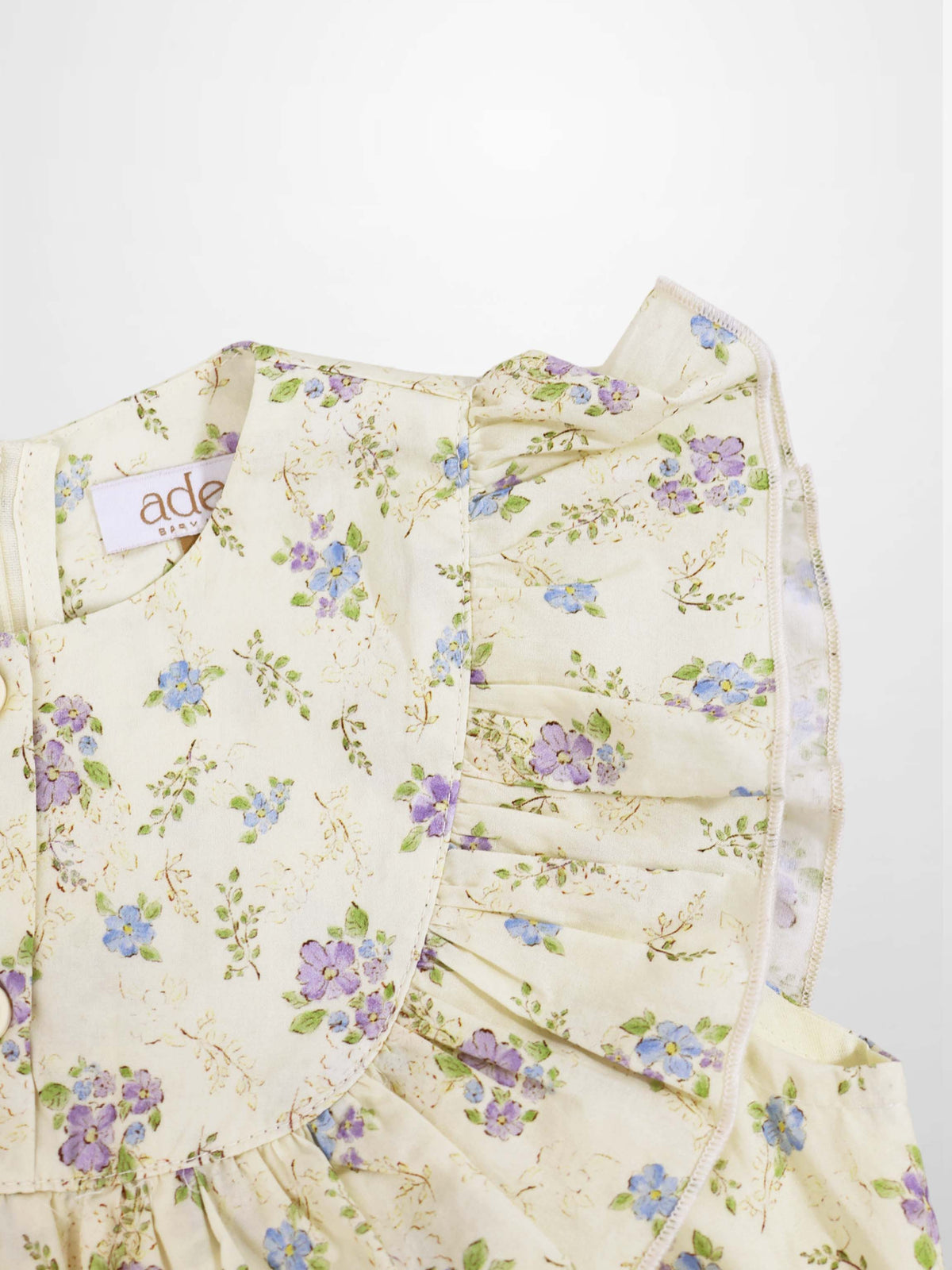 Adee Ivory Flower Dress - Sleeveless, ivory floral print with blue and purple flowers