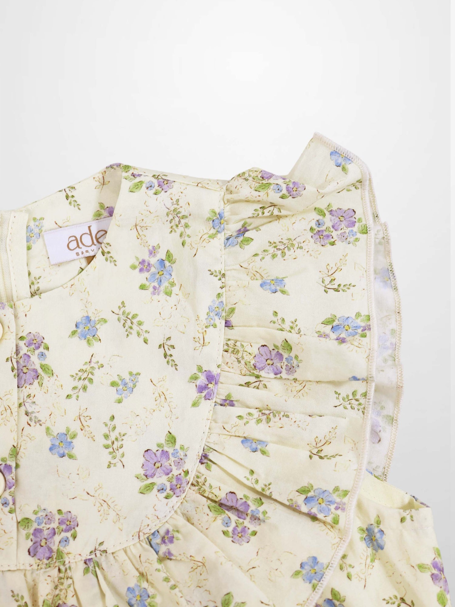 Adee Ivory Flower Dress - Sleeveless, ivory floral print with blue and purple flowers