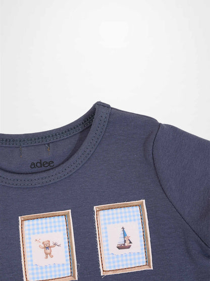 Teddy Frame Set little boys’ navy tee by Adee with two framed blue gingham panels featuring a teddy and a sailboat.