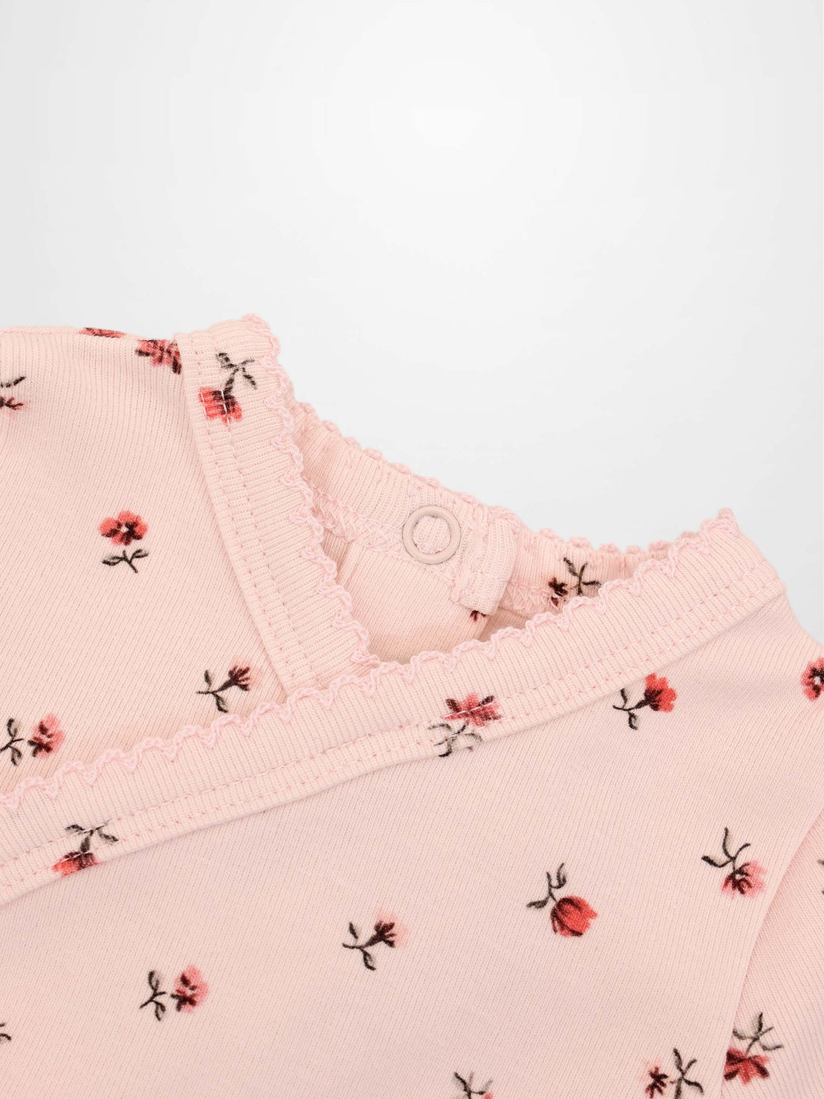Pink Petal Stretchy girls top by Adee, pink floral print with scalloped neckline.