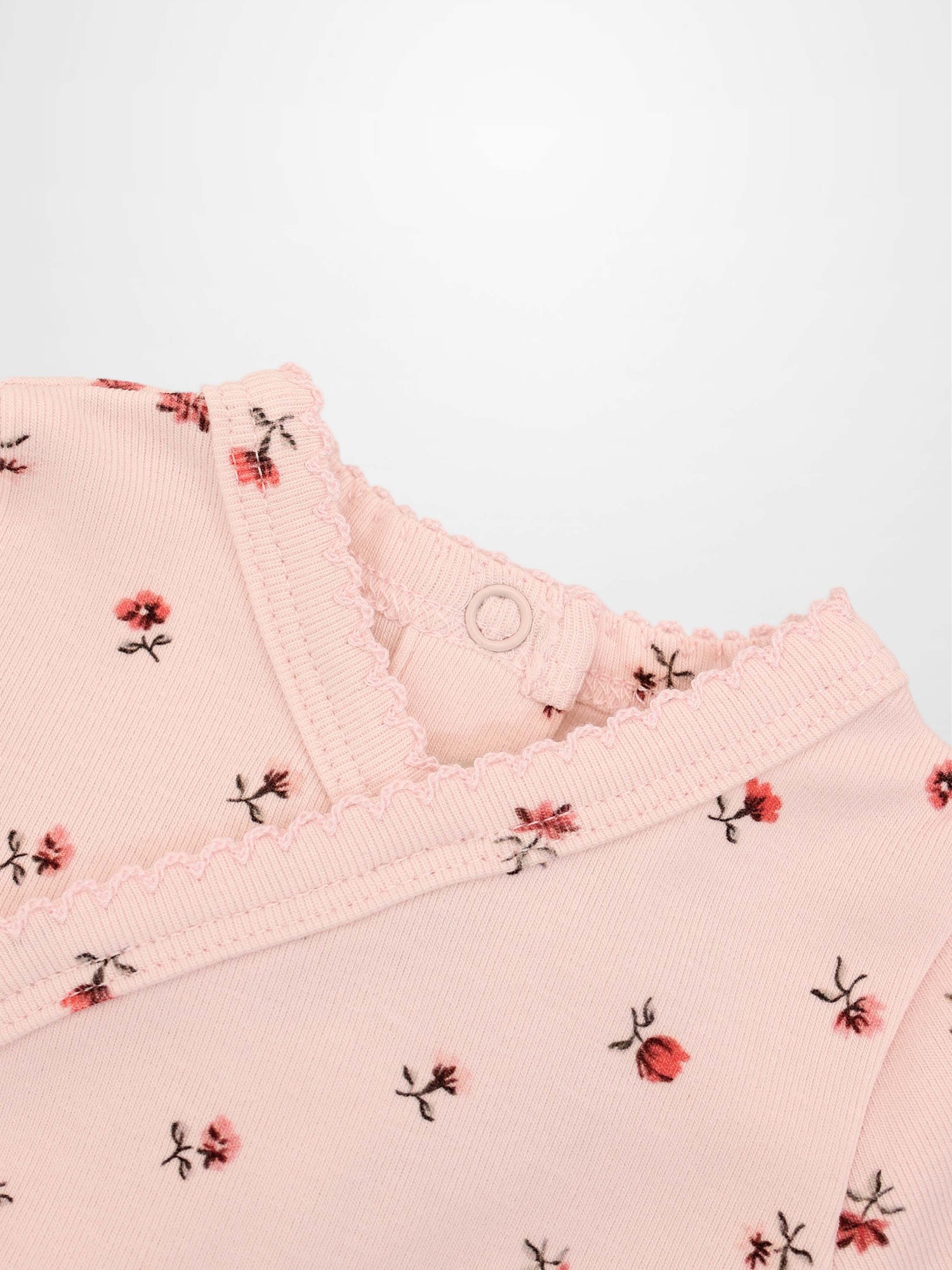 Pink Petal Stretchy girls top by Adee, pink floral print with scalloped neckline.