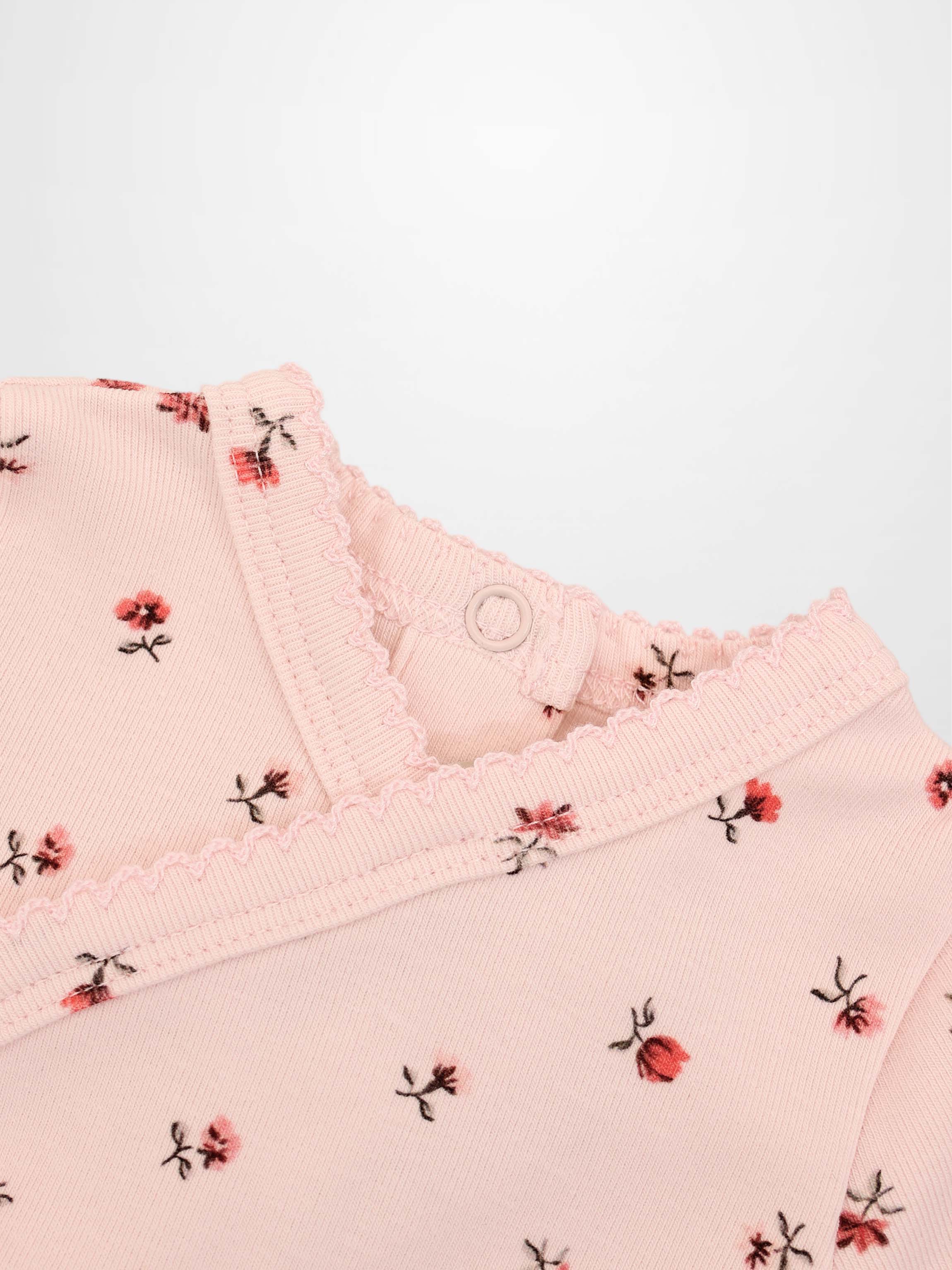 Pink Petal Stretchy girls top by Adee, pink floral print with scalloped neckline.