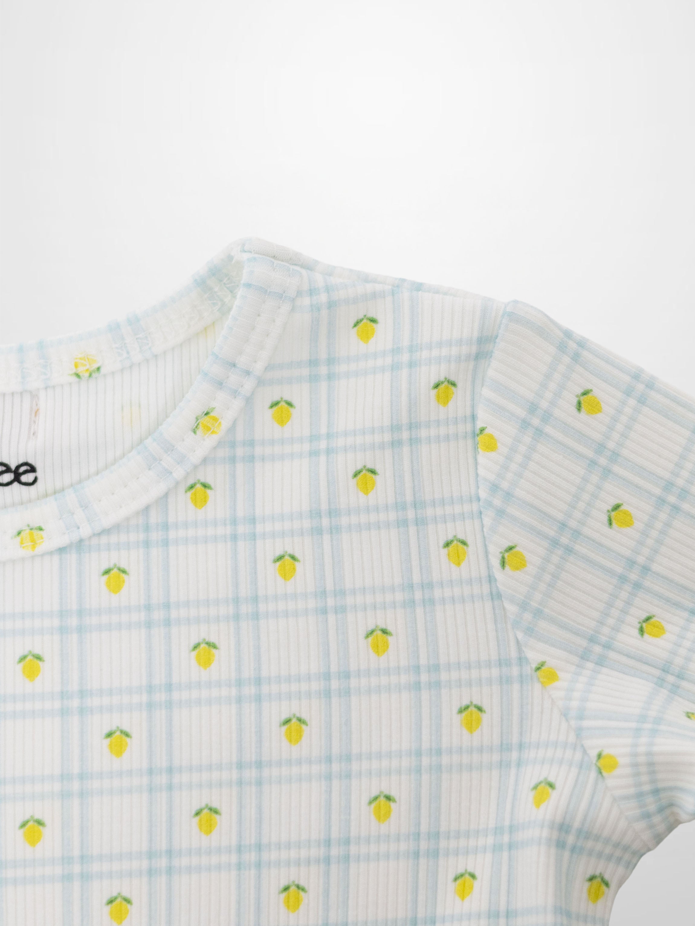 Lemon Window Pajamas for boys; Adee, light blue plaid with yellow lemon prints on a crisp white base.