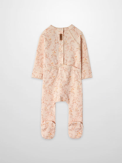 Sweet Meadow Stretchy girls jumpsuit, footed, in light pink floral print by Adee