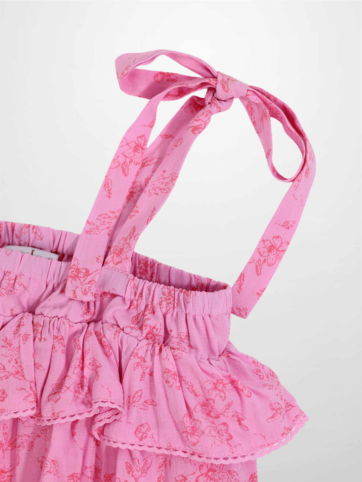 Pink flower romper for girls by Adee; dressy apparel with floral print and tied shoulder straps