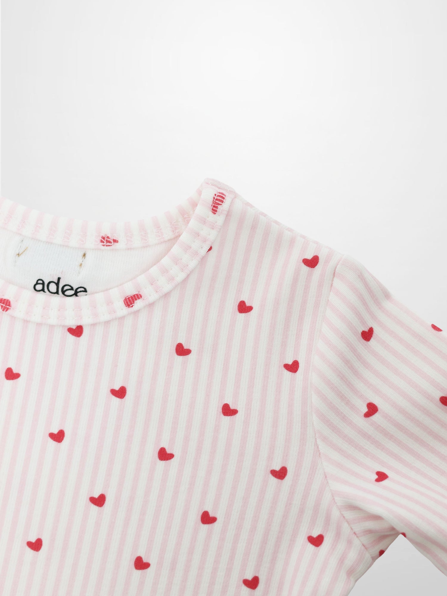 Pink Heart Pajamas top for girls by Adee, pink and white striped fabric with red hearts.