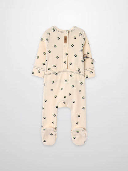 Blue Cherry Stretchy by Adee; cream footed romper with blue cherry print and green leaves.