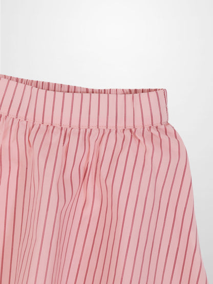 Pink striped cotton skirt with elastic waistband and vertical red stripes.