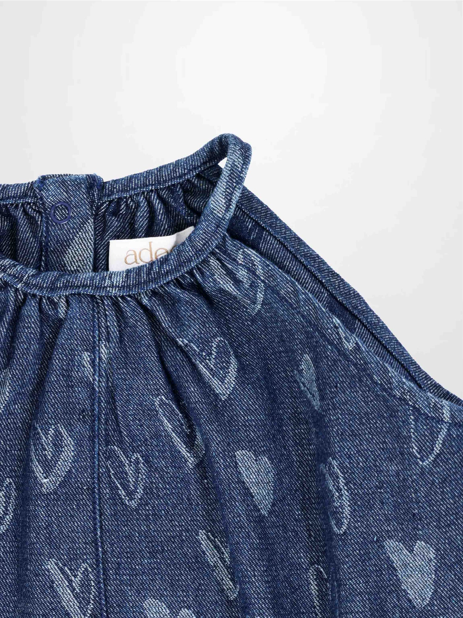 Denim Heart Romper for girls by Adee; blue denim with white heart prints.
