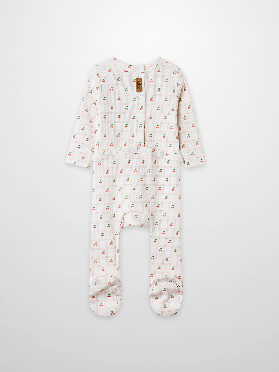 Cherry Window Stretchy girls’ footed stretchies in white with allover tiny red cherry print, Adee brand.