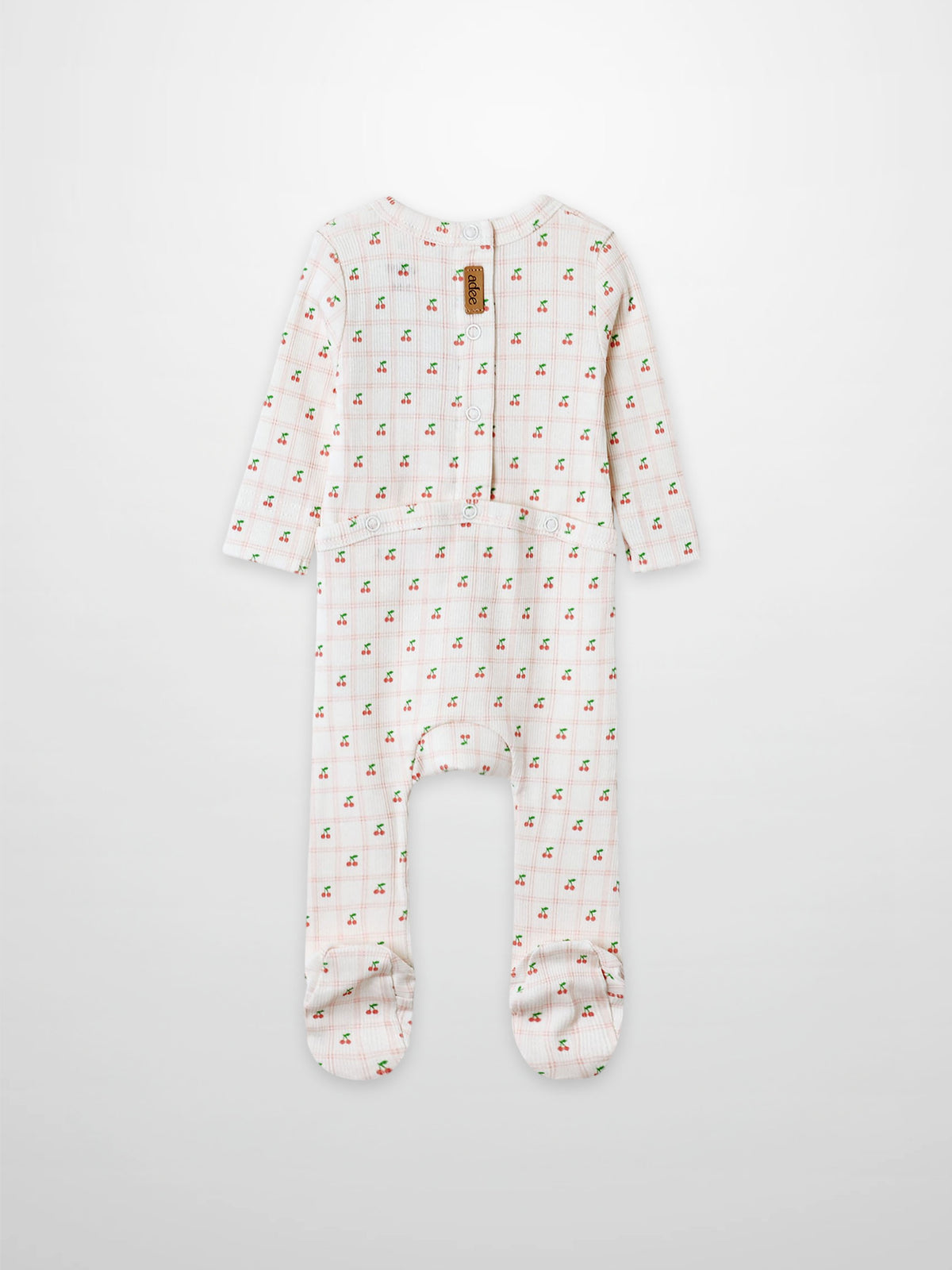Cherry Window Stretchy girls’ footed stretchies in white with allover tiny red cherry print, Adee brand.