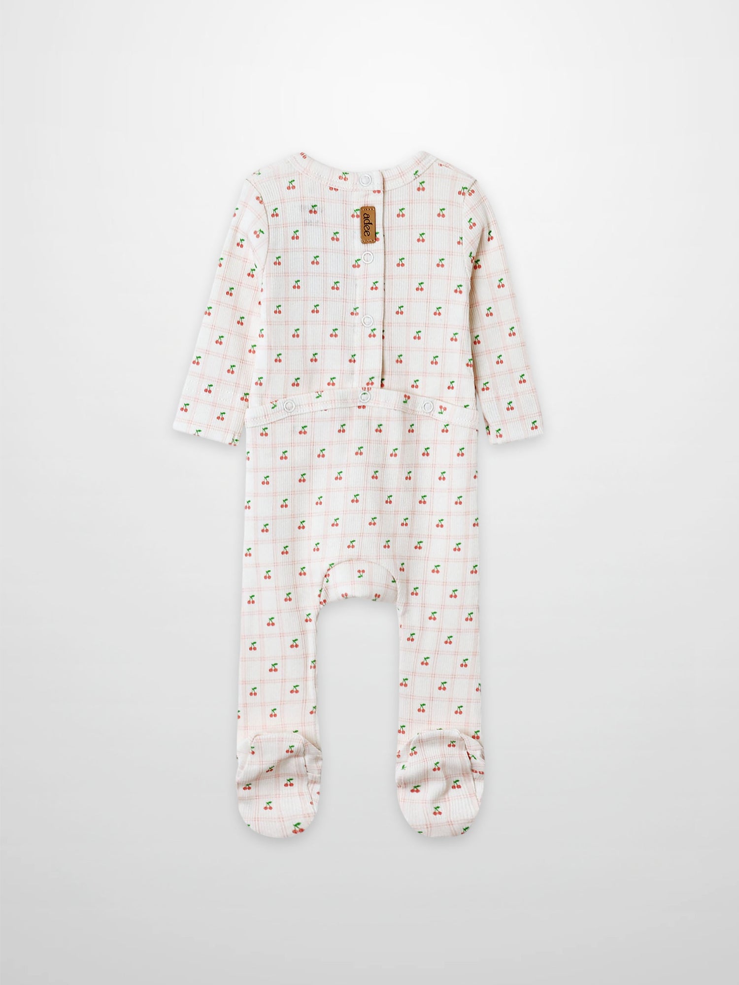 Cherry Window Stretchy girls’ footed stretchies in white with allover tiny red cherry print, Adee brand.