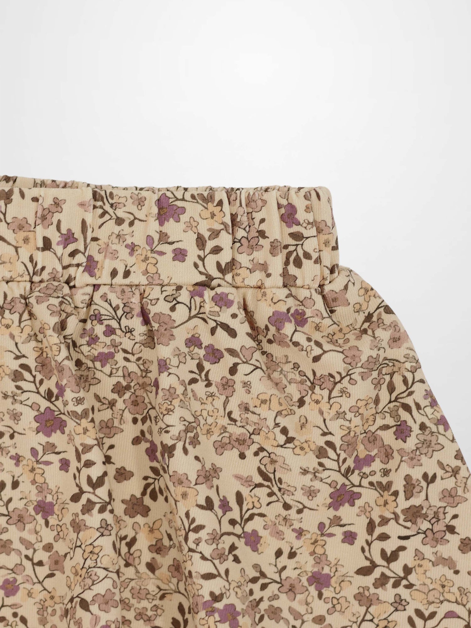Purple Flower Skirt fabric with beige base and purple-brown floral print and elastic waistband.