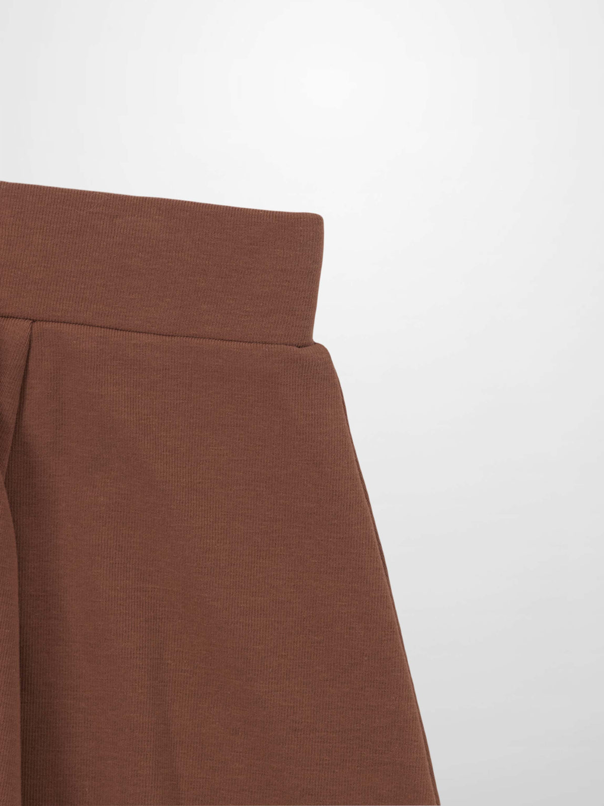 Dark mauve six-panel skirt with structured waistband and visible seam lines.