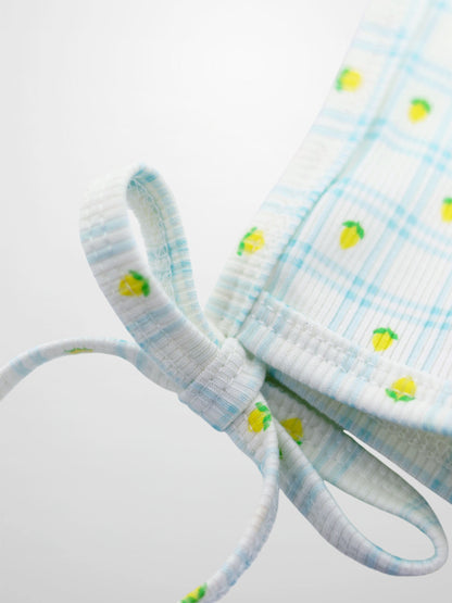 Lemon Window Bonnet for boys by Adee; light blue striped fabric with small yellow lemons and tie straps.