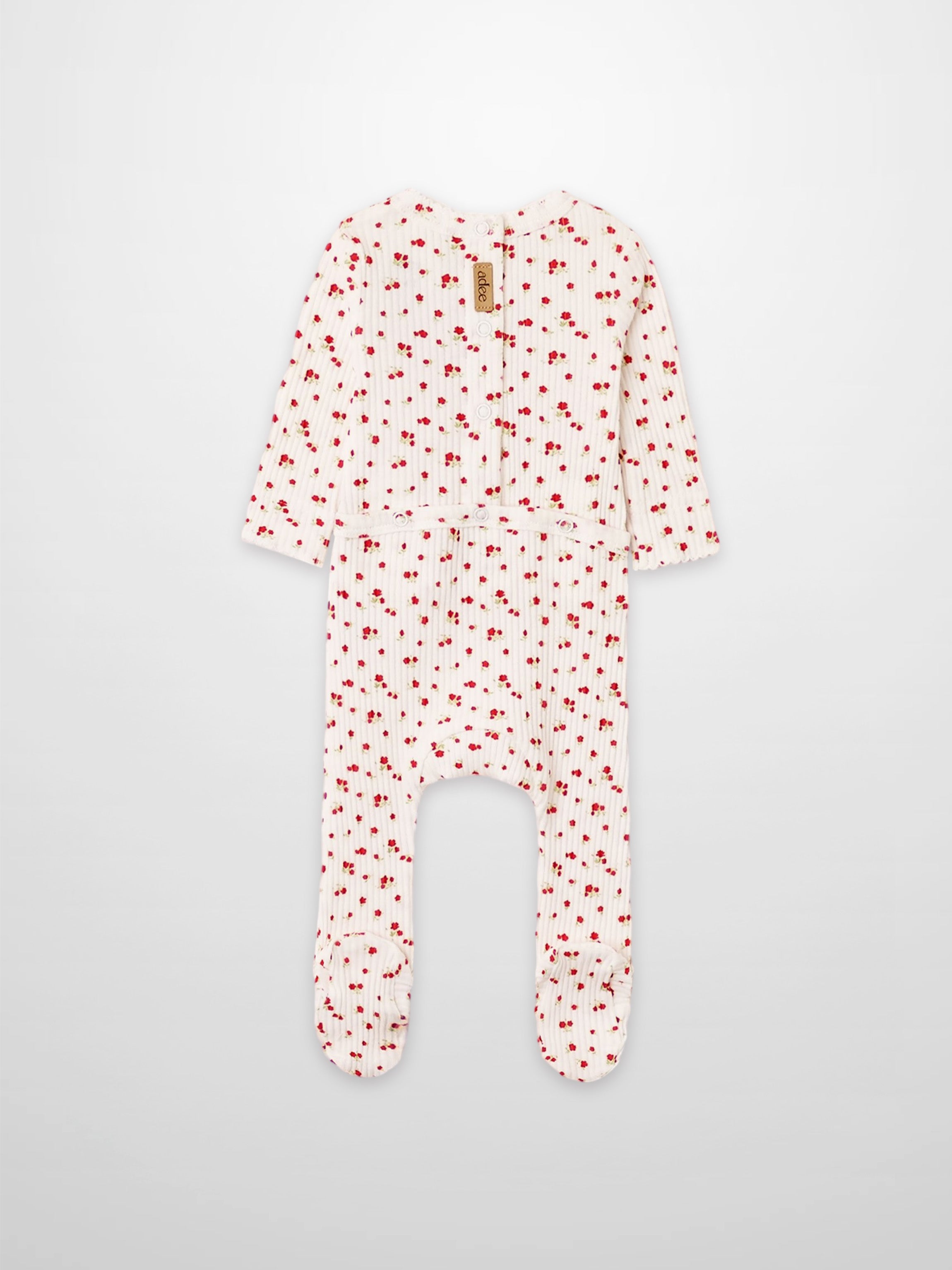 Red Flower Stretchy girls’ footed romper by Adee with tiny red flowers scattered on white fabric