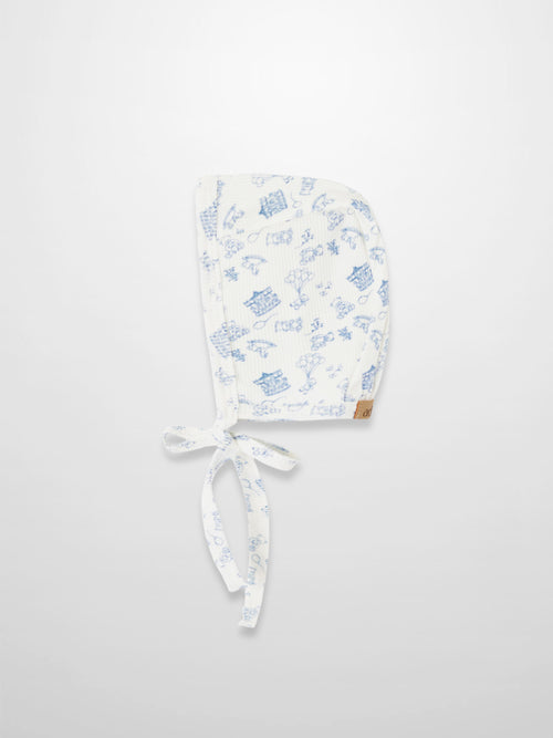 Little Storybook Bonnet - Blue, white fabric with blue playful print, tie strings, Adee tag.