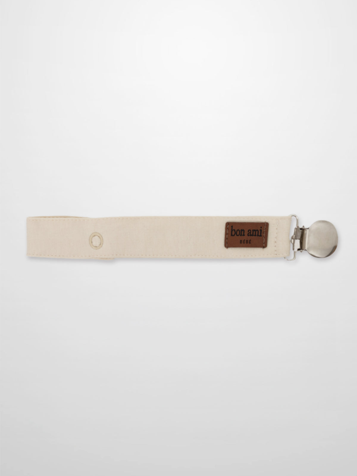 Pacifier clip beige fabric strap with metal clip and Bon Ami patch.
