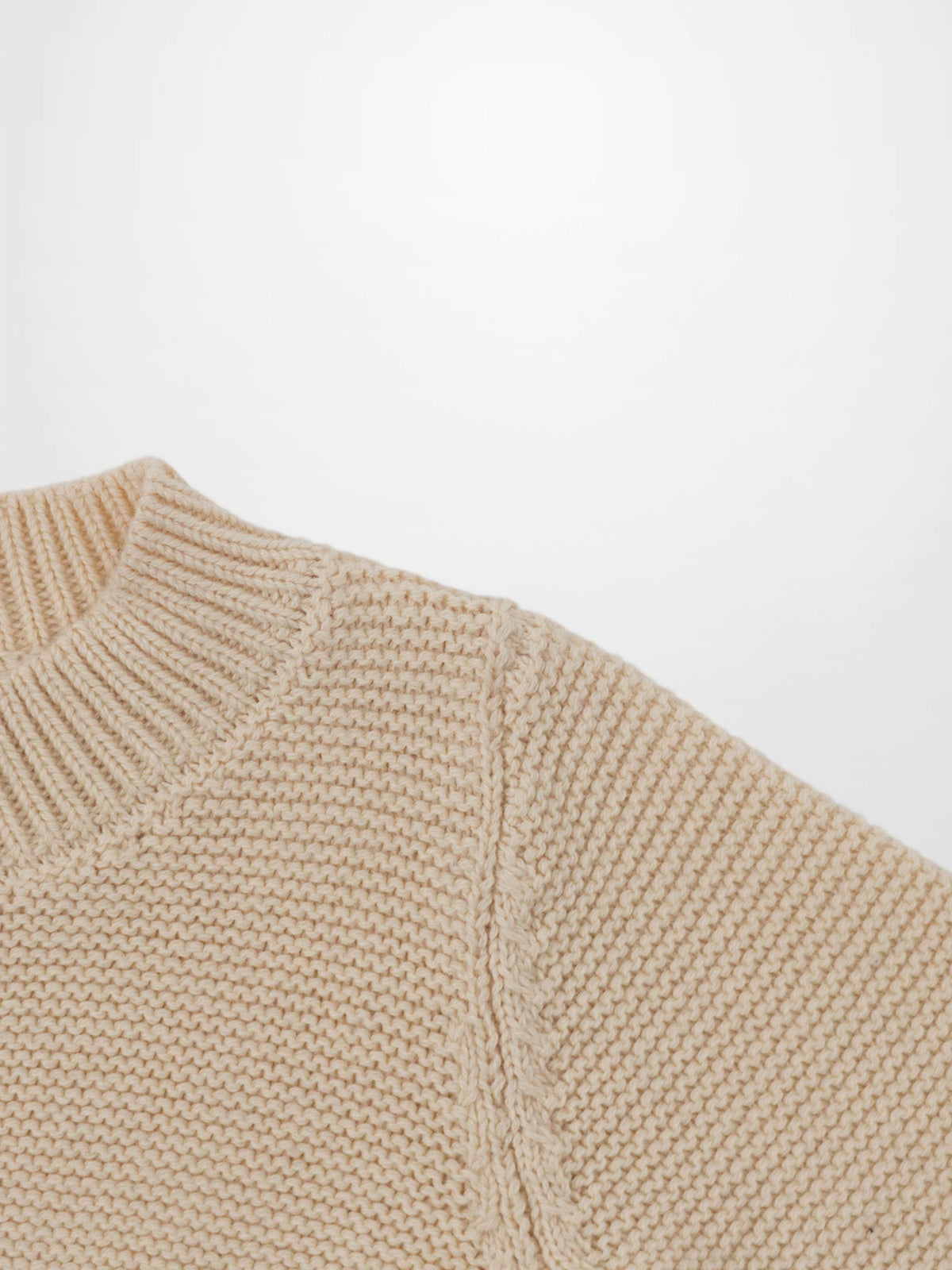 Cropped Cardigan Ivory, unisex dressy knit top with ribbed neckline.