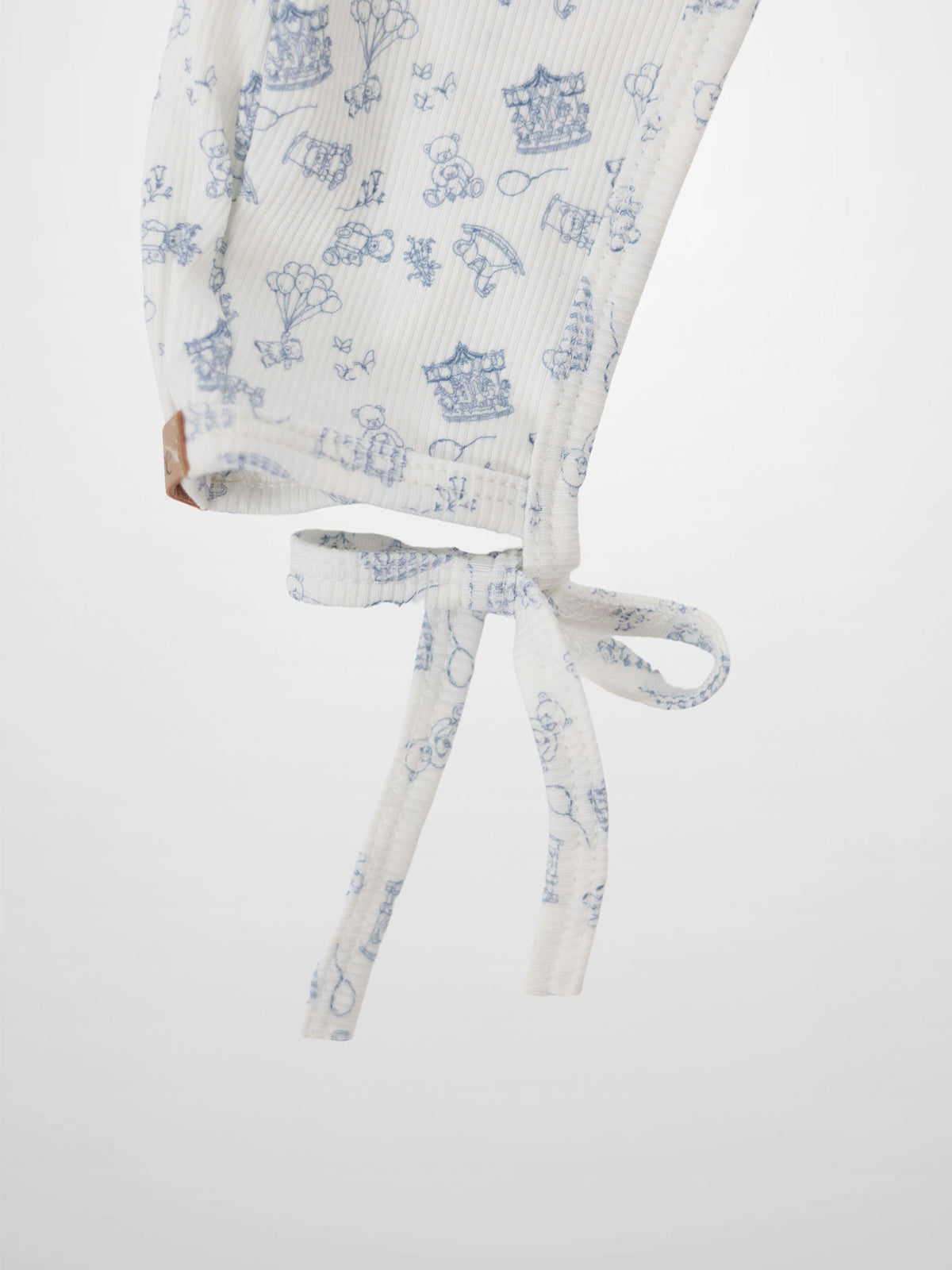 Little Storybook Bonnet Blue; white ribbed knit with blue print and tie strings
