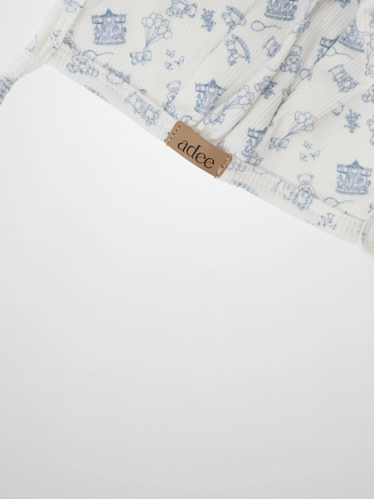 Little Storybook Bonnet by Adee in blue pattern knit fabric for boys