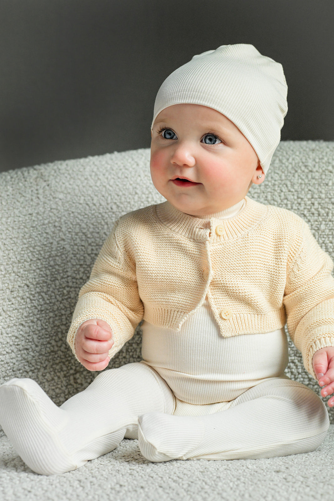 Mock Neck Stretchy Ivory unisex two-piece baby outfit by Adee; cream knit cardigan with leggings.