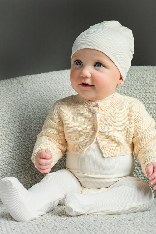 Mock Neck Stretchy Ivory unisex two-piece baby outfit by Adee; cream knit cardigan with leggings.