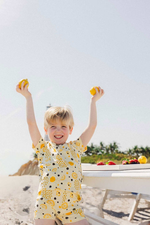 Baby boy wearing lemon print t-shirt and shorts